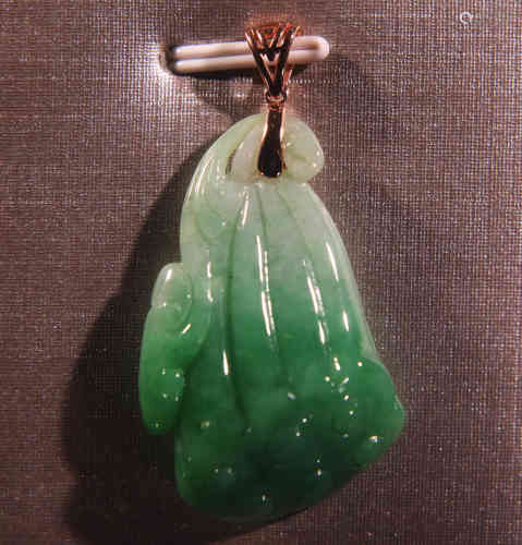 A Chinese Jadeite Lotus Root Pendant