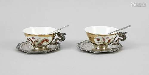 Two teacups with saucers,