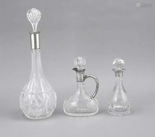Three carafes with silver