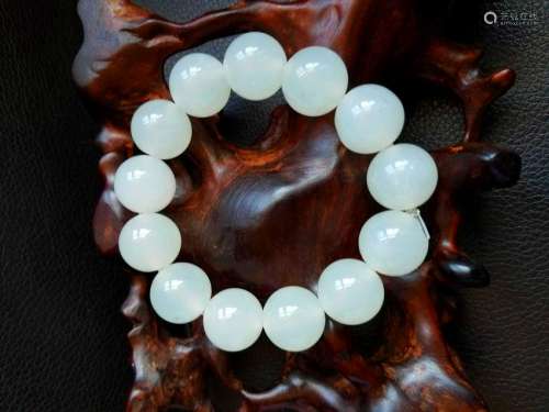 A String of Buddha Beads with White Jade Carved