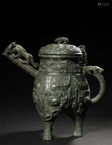 A BRONZE RITUAL MYTHICAL BEAST WINE VESSEL