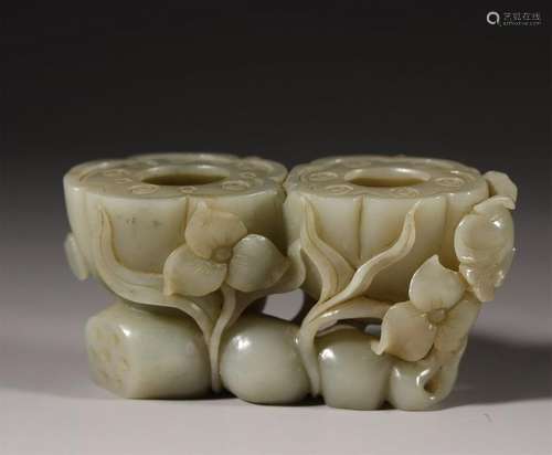 A PALE CELADON JADE CARVED WASHER