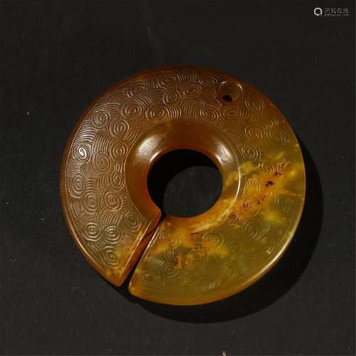 A CELADON/RUSSET JADE CARVED BI DISK