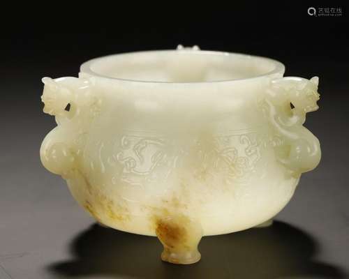 A WHITE/RUSSET JADE CARVED TRIPOD CENSER