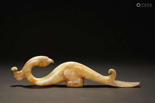 A WHITE/RUSSET JADE CARVED STICK HANDLE