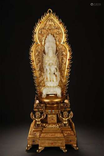 A WHITE JADE CARVED GUANYING FIGURE W/GILT BRONZE STAND