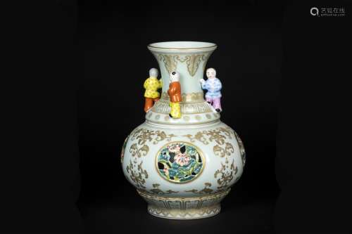 A CHINESE PORCELAIN FAMILLE ROSE FLOWER AND BOY VASE