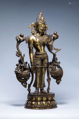A CHINESE BRONZE GUANYIN WITH LOTUS