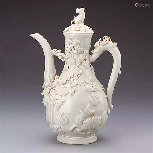 A CHINESE PORCELAIN CARVED FLOWER KETTLE