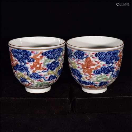 A PAIR OF CHINESE ENAMEL BLUE AND WHITE DRAGON FIGURES CUPS