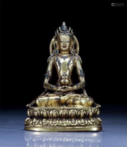 A CHINESE GILT BRONZE SEATED BUDDHA WITH LOTUS