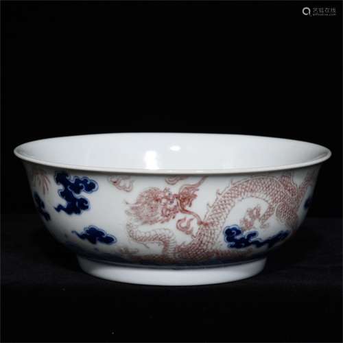 A CHINESE PORCELAIN RED UNDER GLAZE DRAGON BOWL