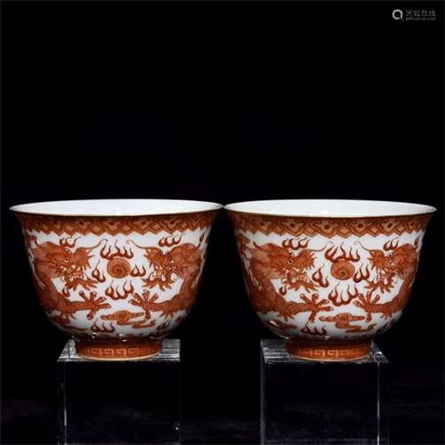 A PAIR OF CHINESE COPPER RED PORCELAIN DRAGON FIGURES CUPS