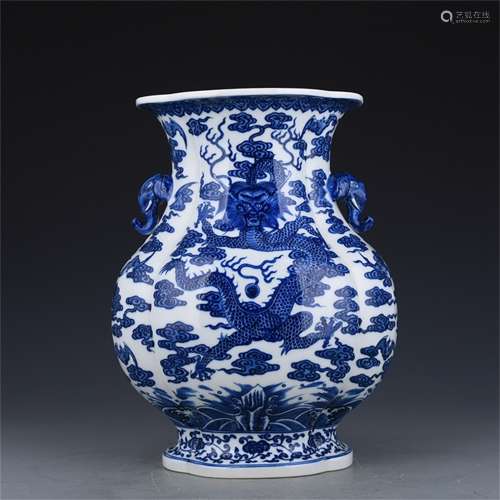 A CHINESE PORCELAIN BLUE AND WHITE DRAGON FIGURES ELEPHANT HANDLE VASE