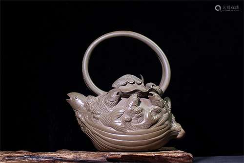 A FINE CHINESE CLAY CARVED LONG HANDLE TEAPOT