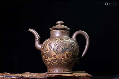 A FINE CHINESE CLAY CARVED DRAGON TEAPOT