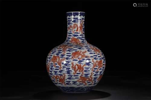 A CHINESE PORCELAIN BLUE AND WHITE COPPER RED TIANQIU VASE