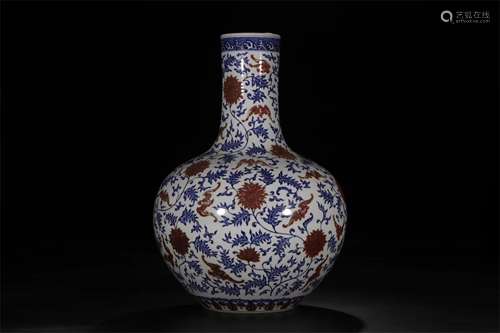 A CHINESE PORCELAIN BLUE AND WHITE COPPER RED FLOWER TIANQIU VASE