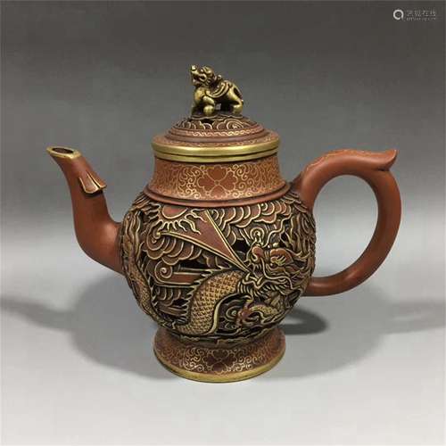 A CHINESE YIXING ZISHA GOLE PAINTED CARVED DRAGON TEAPOT