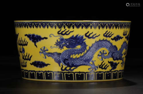 A CHINESE YELLOW GLAZE BLUE AND WHITE DRAGON BASIN