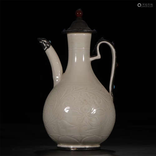 A CHINESE PORCELAIN GLAZE CARVED FLOWER TEAPOT