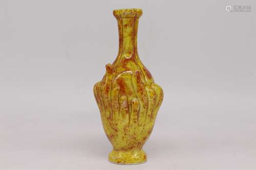 A CHINESE PORCELAIN CARVED BUDDHA HAND VASE