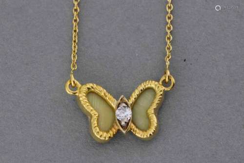 Gold necklace with butterfly motif centered in a b…