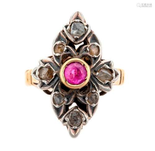 Antique ring in two golds centred on a ruby in a d…