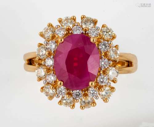 Gold Flower ring set with a 3.16 carat oval ruby (…