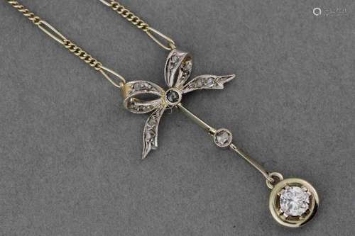 Gold necklace with knot pattern retaining a diamon…