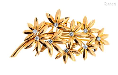 Gold flower spray brooch decorated with brilliants…