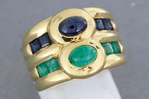 Gold ring set with a sapphire and an emerald caboc…