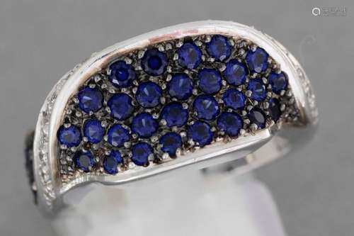 Gold ring set with sapphire pavings separated by l…