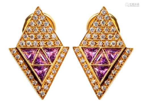 Pair of diamond shaped gold earrings enriched with…