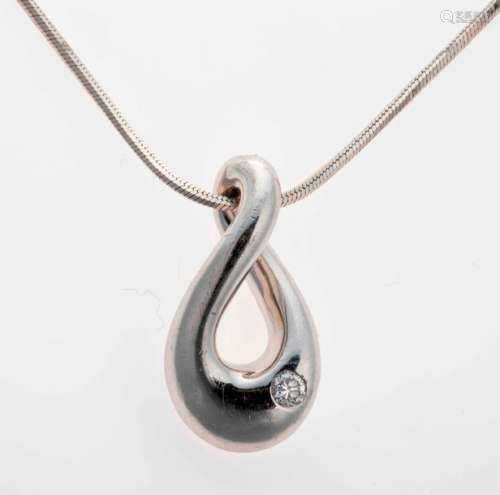 White gold chain holding a pendant set with a bril…