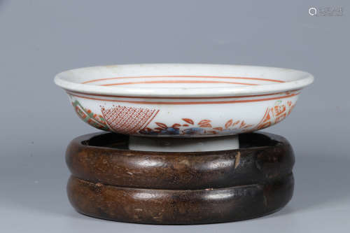 UNDERGLAZED RED AND GREEN DISH WITH WOODEN STAND