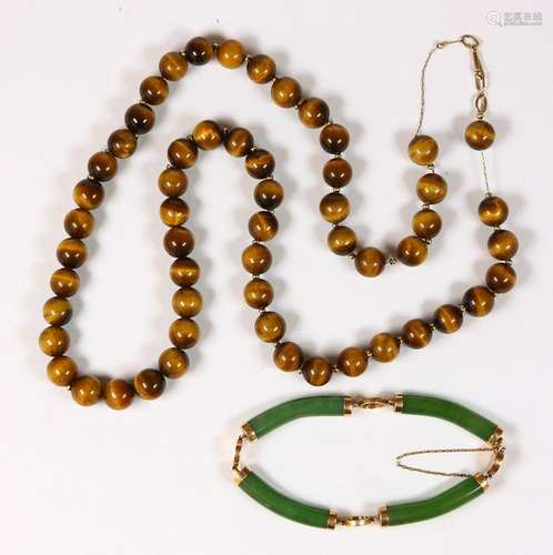 (Lot of 2) Nephrite, tigers eye, 14k yellow gold