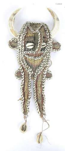 Papua New Guinea effigy with applied shells or prized