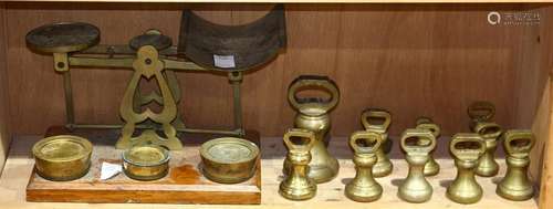 One shelf of brass weights and scale