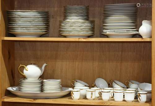 Two shelves of assorted porcelain tableware