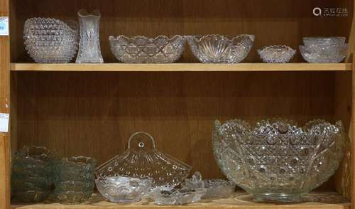 Two shelves of glass table articles