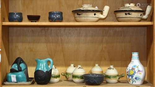 Two shelves of pottery