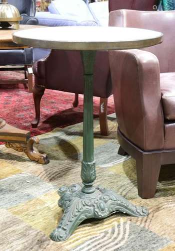 Cast iron cafe table with a grey marble top