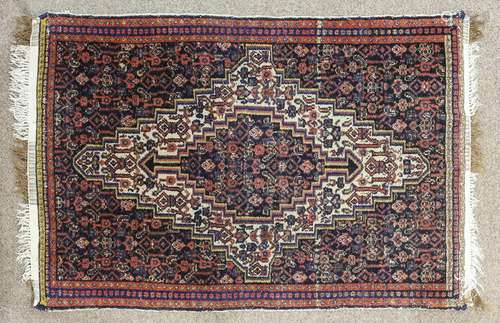 A Persian Hamadan carpet