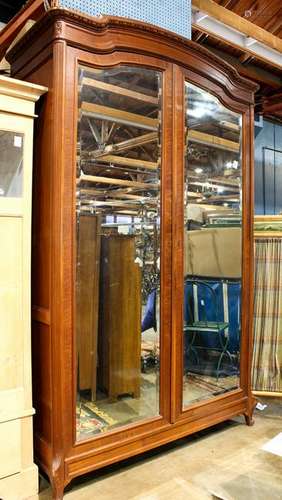 Renaissance Revival walnut armoire with beveled