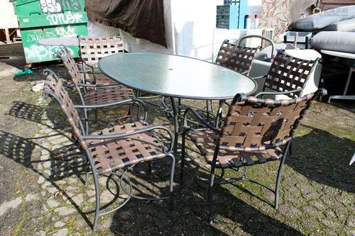 Brown Jordan out door chipped glass oval dining table