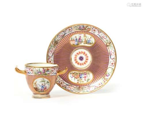 A Sèvres two handled cup and saucer (gobelet etrus…