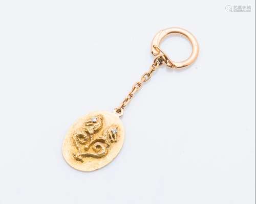 Porte clef en or jaune 18 carats (750 millièmes), …