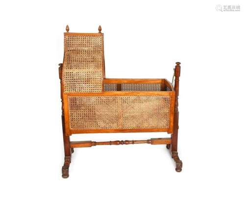 An English mahogany and cane frame rocking cradle …
