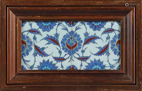 A PAIR OF FRAMED IZNIK TILES